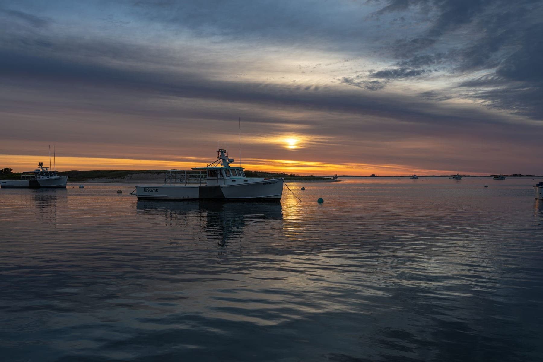 Working boat moored at dawn in a Cape harbor