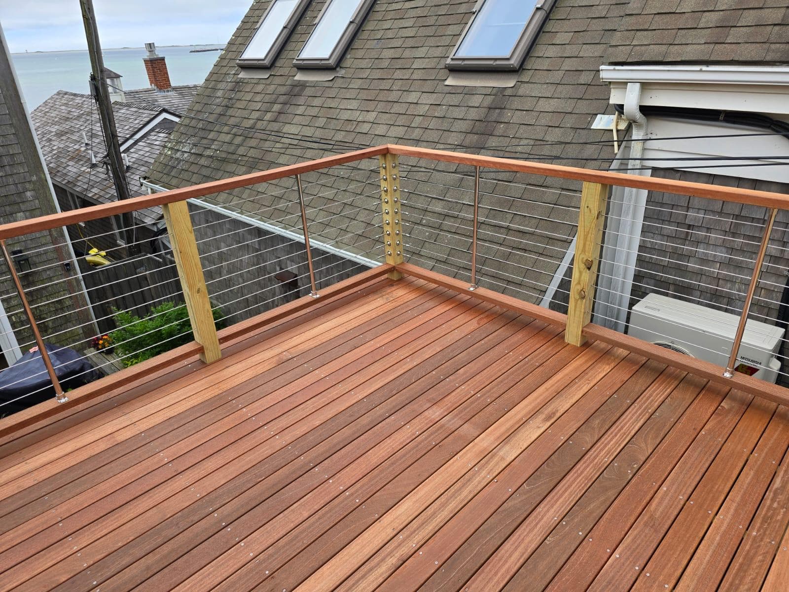 Mahogany roof deck and cable rail over the harbor
