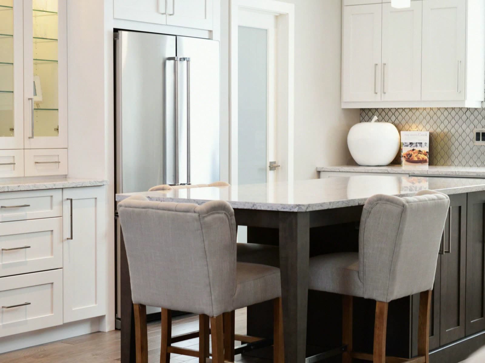 Custom kitchen and island paneling in Osterville