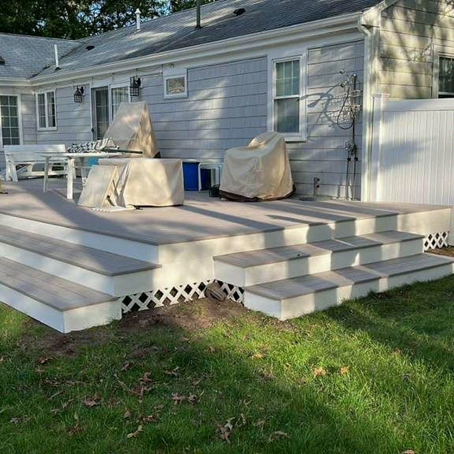 Finished composite deck with wraparound steps