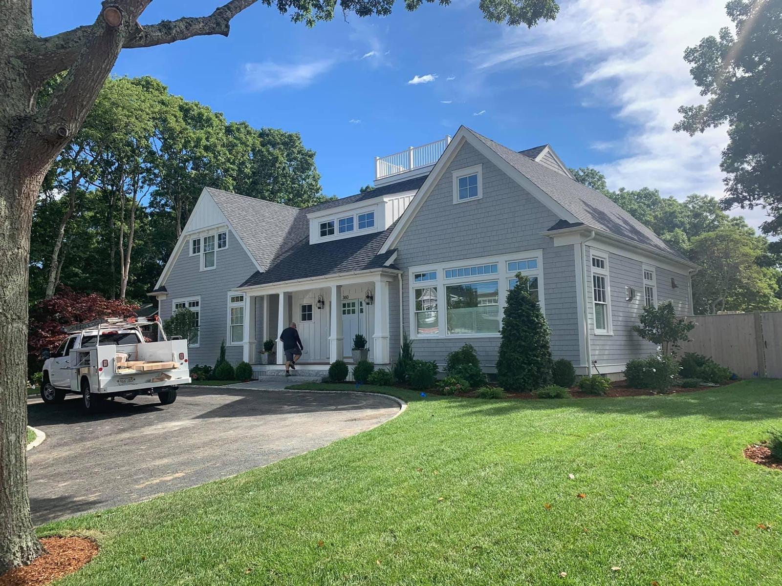 Completed custom home with rooftop deck