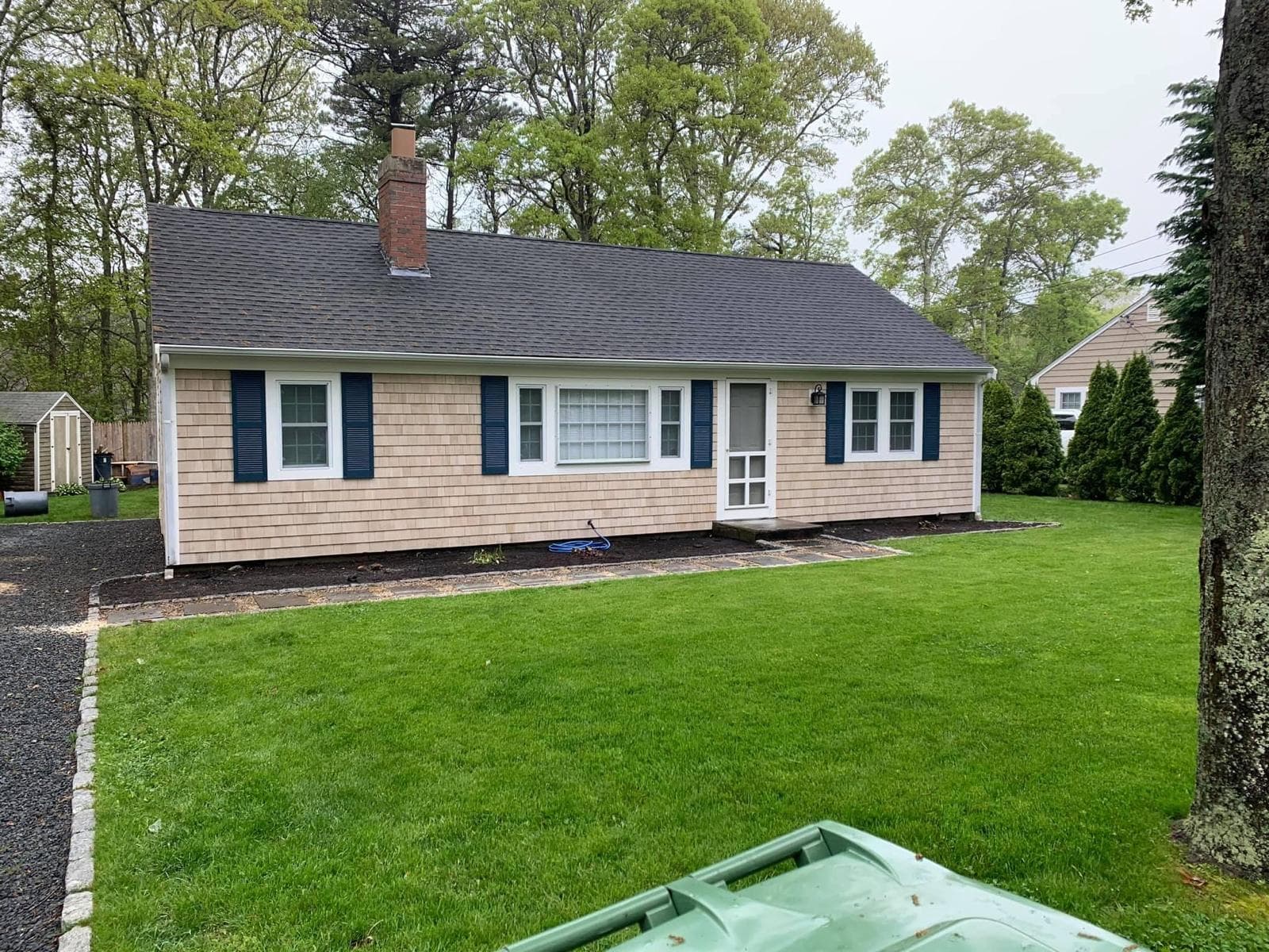 Re shingled cape with blue shutters