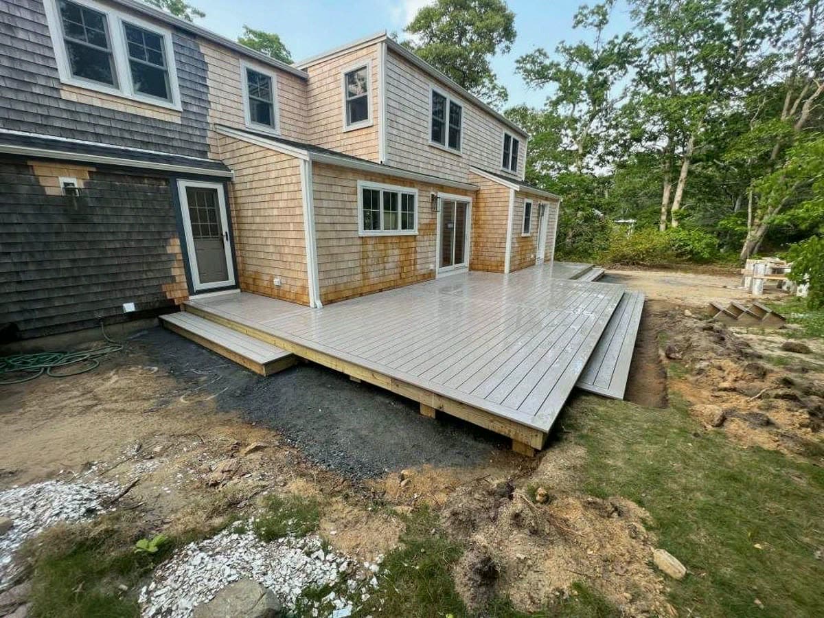 New composite deck running the full width of the house