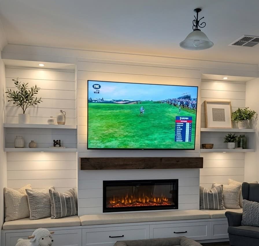 Shiplap-panelled media wall with a shiplap fireplace surround, floating shelves and built-in window seats